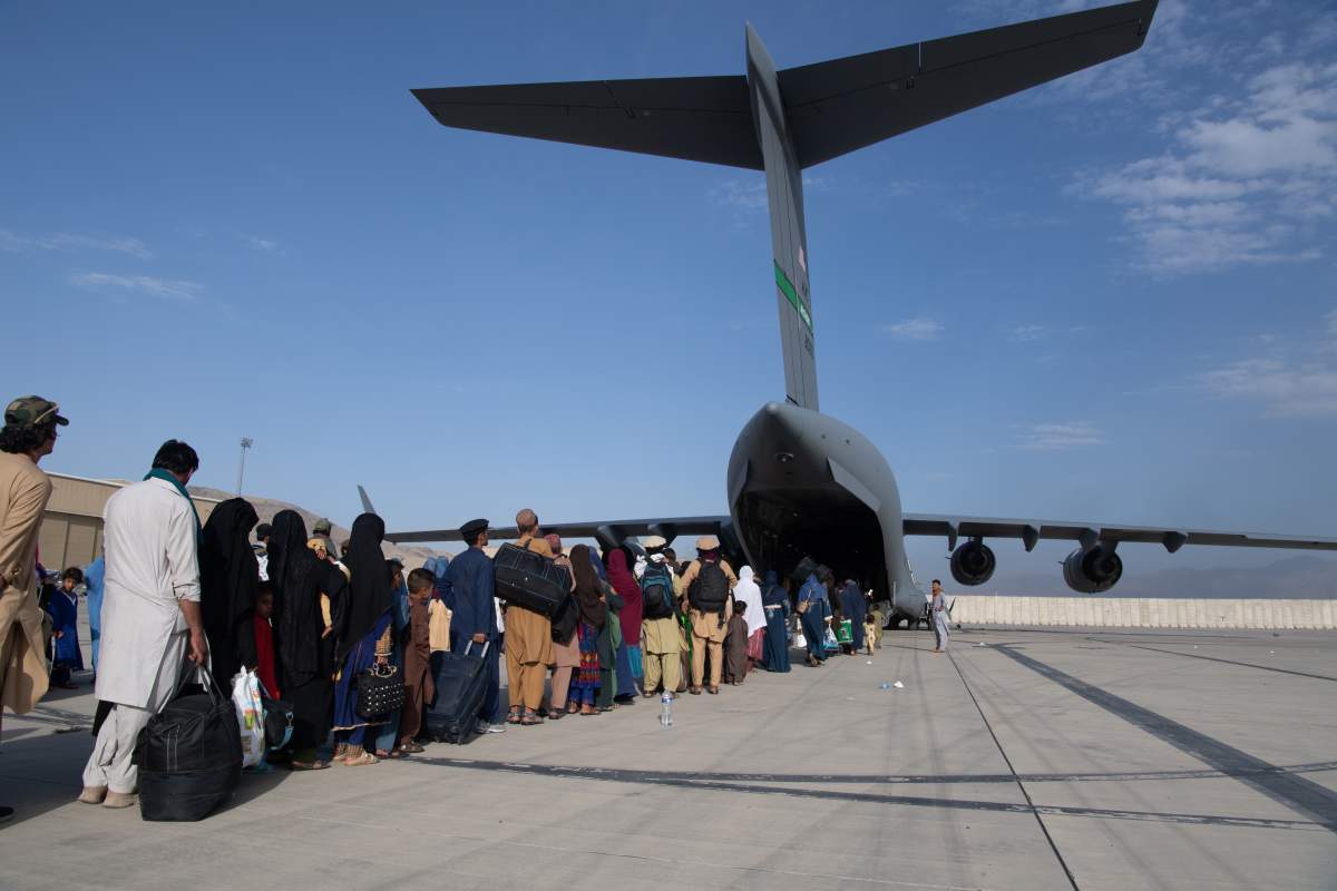U.S. Air Force loadmasters and pilots assigned to the 816th Expeditionary Airlift Squadron, load passengers aboard a U.S. Air Force C-17 Globemaster III in support of the Afghanistan evacuation at Hamid Karzai International Airport (HKIA) on Aug. 24, 2021 in Kabul, Afghanistan.