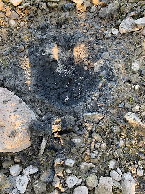 A crater left after the RCMP’s EDU countercharged the device and destroyed it.