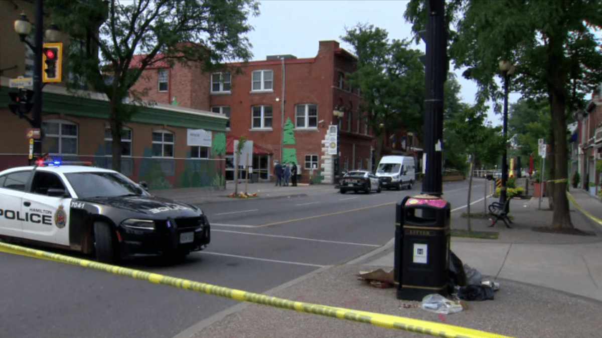Hamilton police investigate the city’s 12th homicide of 2021 which occurred near a parking lot at Mission Services, located on James Street North, just north of Barton Street on Aug. 8, 2021.