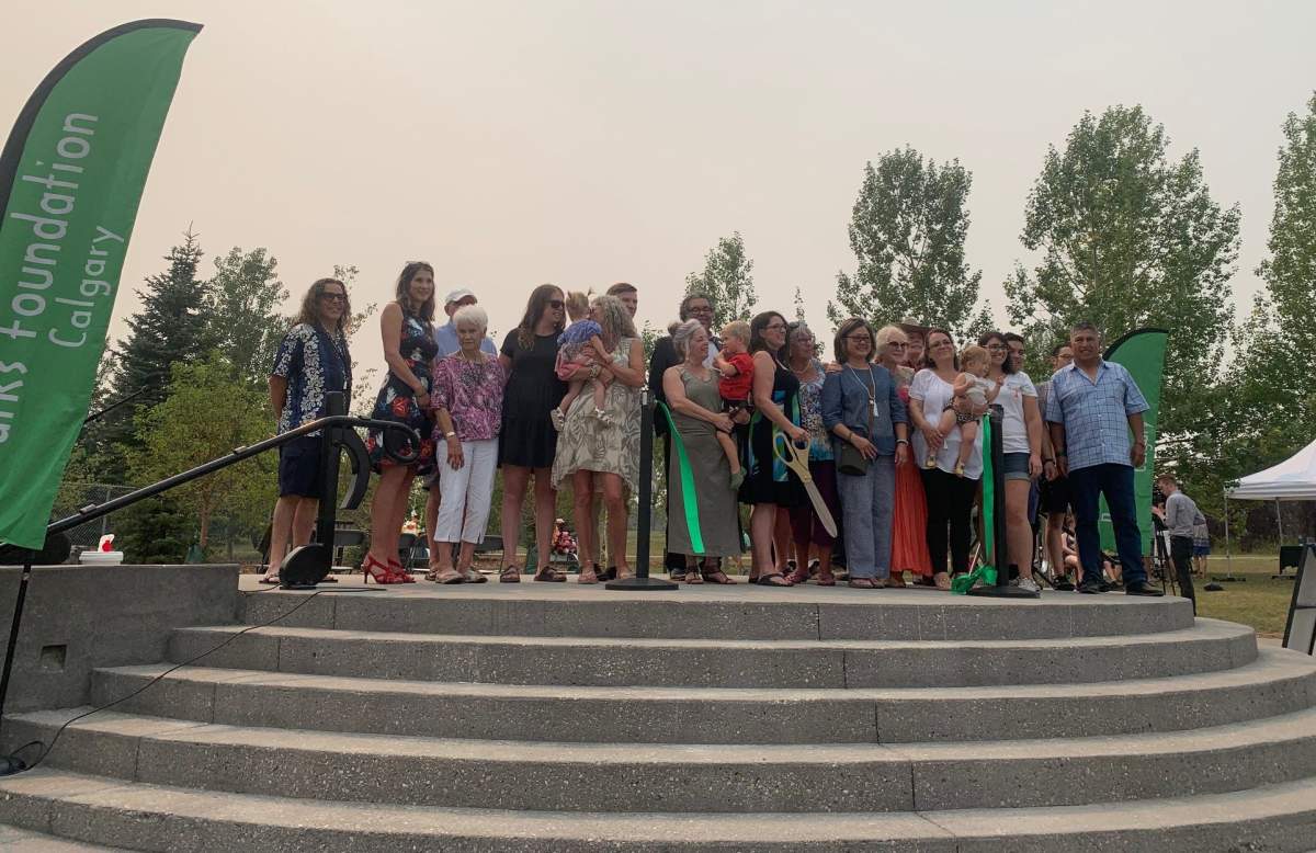 Family members cut the ribbon at Quinterra Legacy Garden’s grand opening in Calgary on Saturday, Aug. 14, 2021.