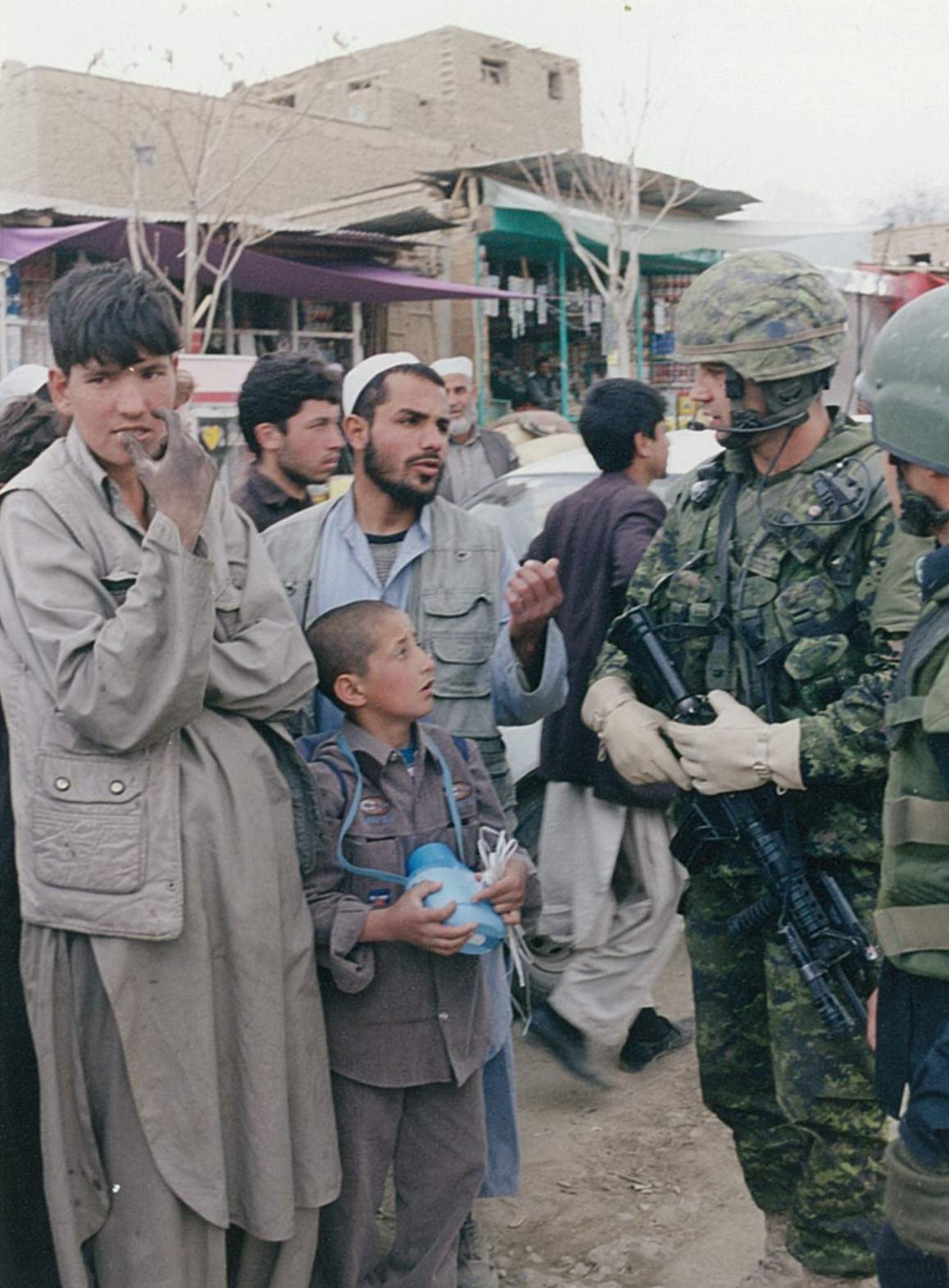 Canadian troops visiting a village in the mountains near Kabul. (2004)