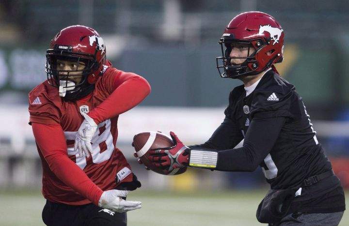 Calgary Stampeders quarterback Bo Levi Mitchell (19) passes the ball to Calgary Stampeders slotback Kamar Jorden (88) during a team practice in Edmonton, Friday, November 23, 2018.