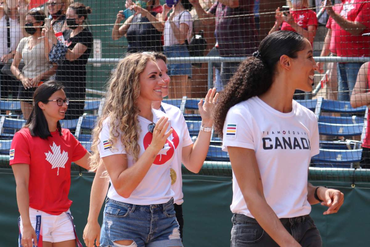 (Left to right) Maggie Mac Neil, Susanne Grainger, Jen Martins, and Miranda Ayim waving at crowd of supporters cheering them on during the London Olympic celebration at Labatt Park on Saturday, August 28, 2021