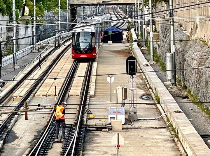 Crews inspect the damaged Confederation Line train just east of Tunney’s Pasture station on Monday, Aug. 9, 2021. Ten trains have now been found to have similar issues.