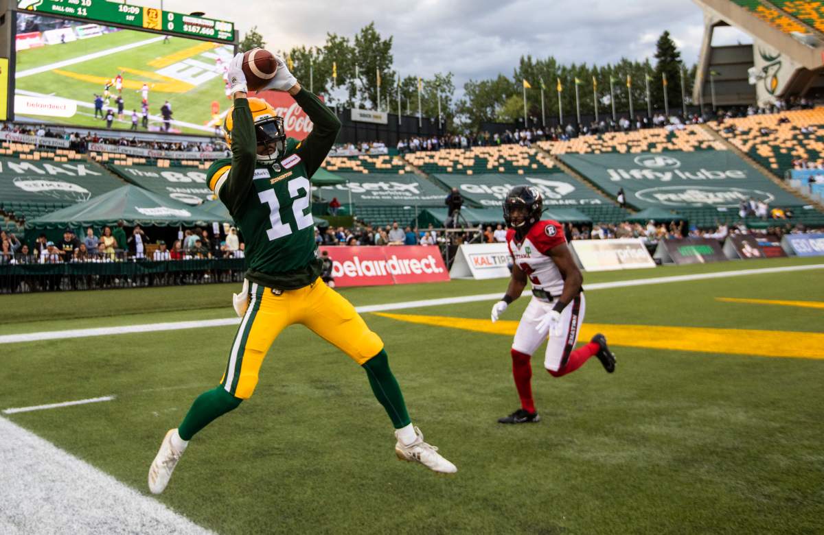 Ottawa Redblacks' Randall Evans (2) gives chase as Edmonton Elks' Mike Jones (12) makes the catch out of bounds during first half CFL action in Edmonton, Alta., on Saturday August 7, 2021. 