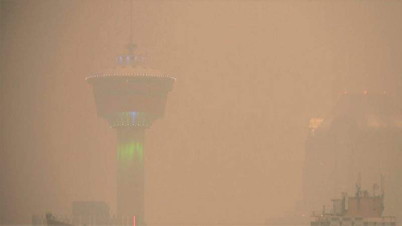 Smoke obscures the sight of the Calgary Tower on Monday, Aug. 16, 2021.