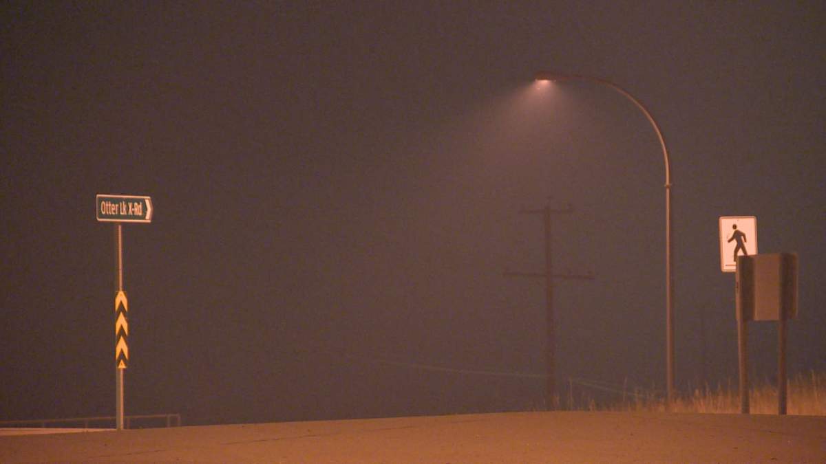 Ash is seen falling in the Spallumcheen area near Vernon Sunday night from the White Rock Lake fire.