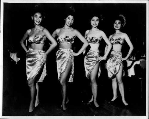 Black and white photo of four “China Dolls,” the regular dancers at Chinatown’s Marco Polo Restaurant.