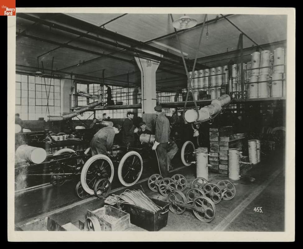 Workers on the Ford Motor Company assembly line circa 1914