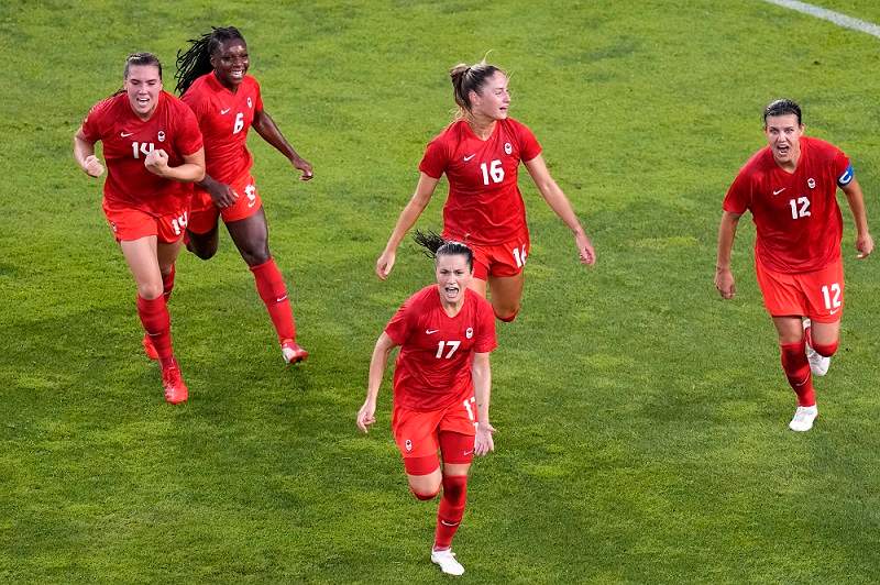 Canada’s Jessie Fleming, 17, celebrates scoring the opening goal from the penalty spot during a women’s semifinal soccer match against United States at the 2020 Summer Olympics, Monday, Aug. 2, 2021, in Kashima, Japan.