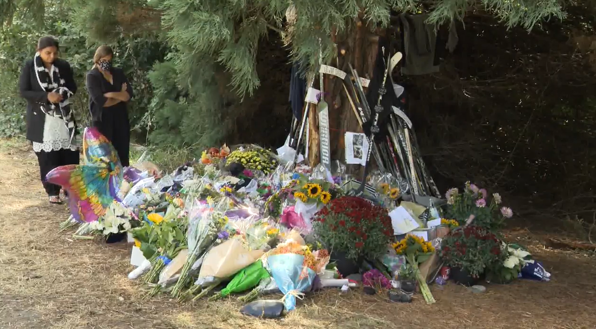A growing memorial at the site of the fatal crash in Surrey.