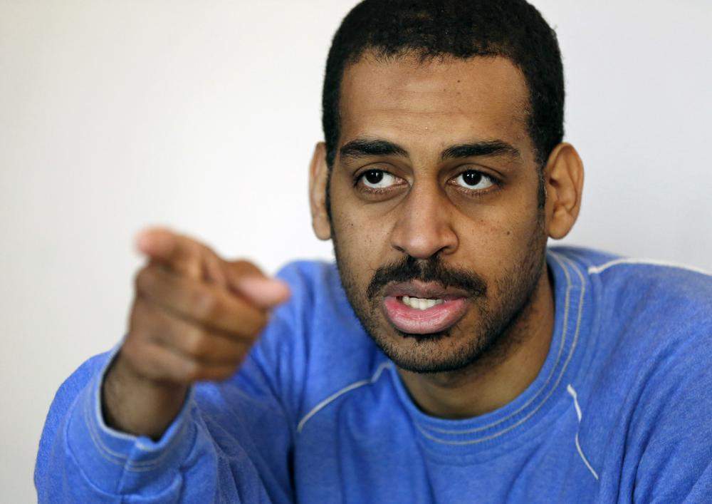 FILE - In this Friday, March 30, 2018, file photo, Alexanda Amon Kotey, allegedly among four British jihadis who made up a brutal Islamic State cell dubbed "The Beatles," speaks during an interview with The Associated Press at a security center in Kobani, Syria.