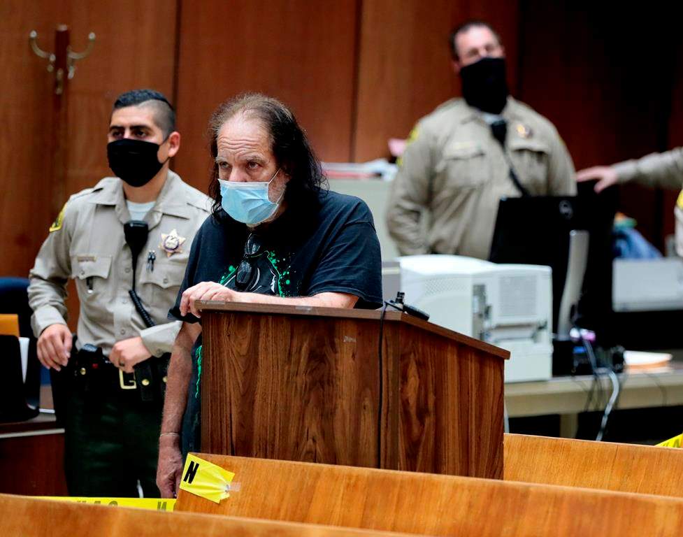 In this Tuesday, June 23, 2020, file photo, adult film star Ron Jeremy, second from left, makes his first court appearance in Los Angeles.