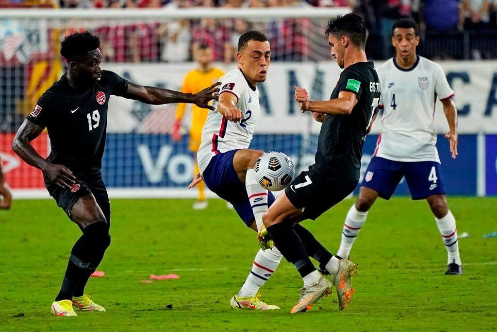 United States defender Sergino Dest (2) battles for the ball with Canada defender Alphonso Davies (19) and Canada midfielder Stephen Eustaquio (7) during the first half of a World Cup soccer qualifier in Nashville, Tenn., Sunday, Sept. 5, 2021.