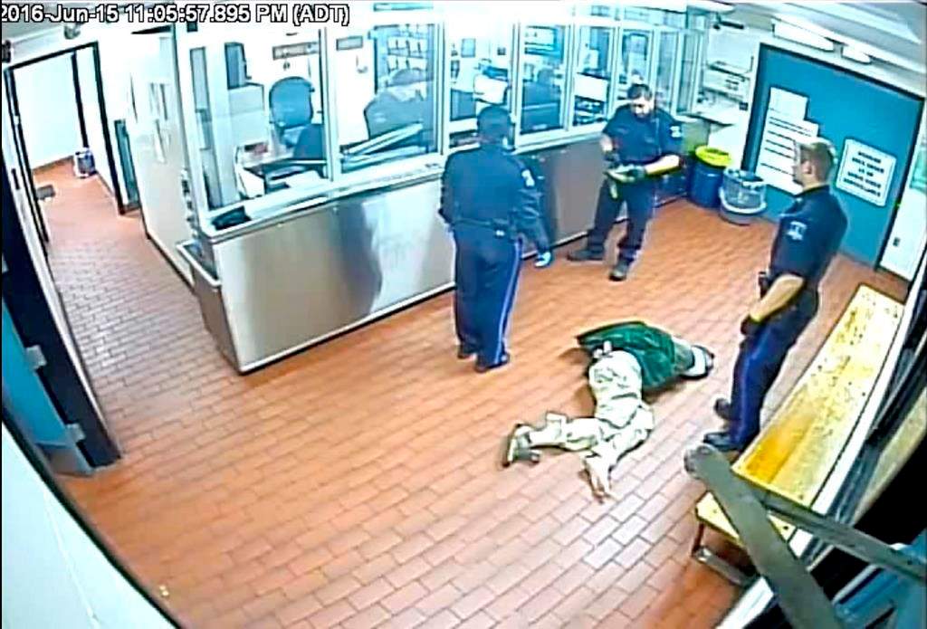 Corey Rogers lies on the floor under police custody at the Halifax police station, wearing a spit hood at about 11 p.m. on June 15, 2016 in this still image taken from surveillance video provided by Nova Scotia Courts. THE CANADIAN PRESS/HO, Province of Nova Scotia Courts