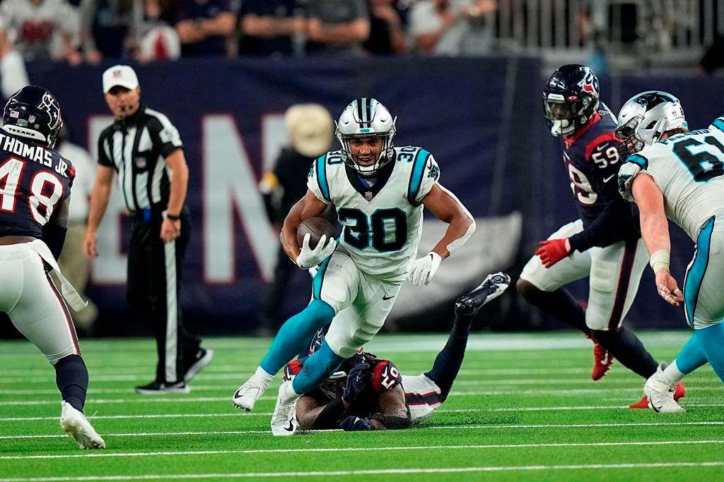 Carolina Panthers running back Chuba Hubbard (30) rushes for a gain against the Houston Texans during the second half of an NFL football game Thursday, Sept. 23, 2021, in Houston.