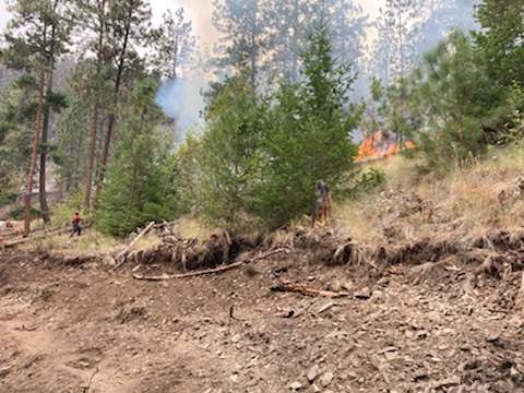 The White Rock Lake wildfire has been reclassified to being held. 