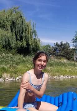 Joseph’s 11-year-old daughter Avery clutching her sore arm after her COVID-19 shot.