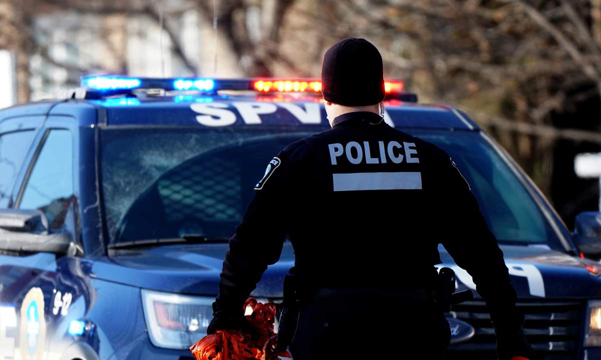 Montreal police officer at a crime scene in Montreal, Que., Sunday, February 14, 2021. 