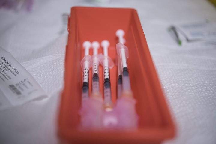 Doses of COVID-19 vaccine are prepared in this file photo.