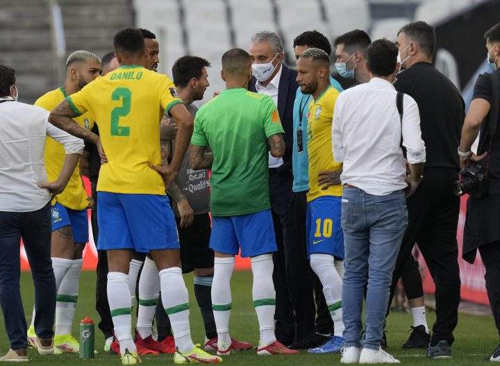 Brazil’s coach Tite talks with Argentina’s Lionel Messi and Brazil’s Neymar as the soccer game is interrupted by health authorities during a qualifying soccer match for the FIFA World Cup Qatar 2022 at Neo Quimica Arena stadium in Sao Paulo, Brazil, Sunday, Sept.5, 2021.