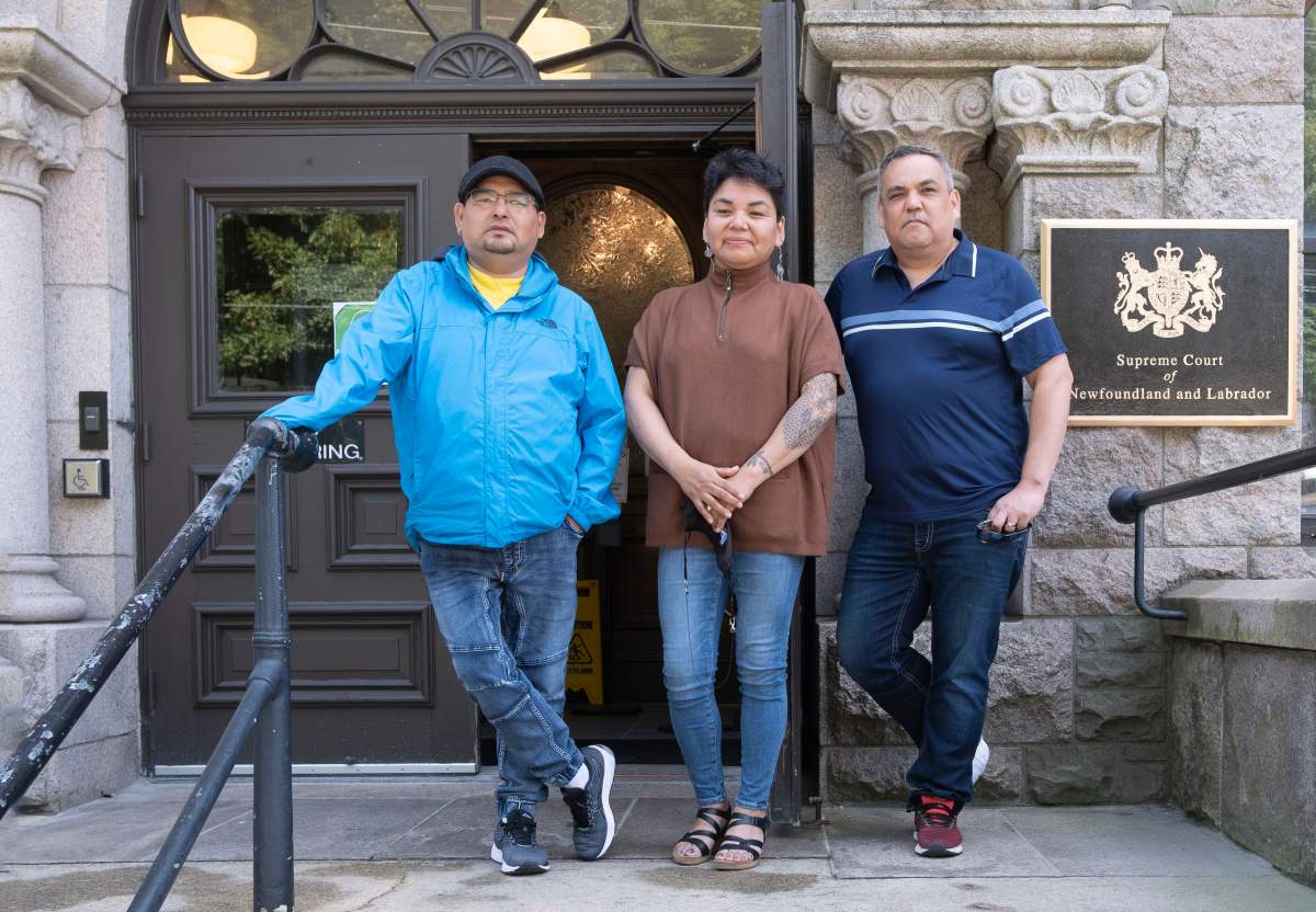 Innu Grand Chief Etienne Rich (Innu Nation), left, Deputy Grand Chief Mary Ann Nui (Innu Nation) and Chief Eugene Hart (Sheshatshiu Innu First Nation) outside the Supreme Court bof Newfoundland and Labrador in St John's after filing lawsuits against the Governments of Canada and Newfoundland and Labrador over Muskrat Falls rate mitigation agreement August 10th, 2021. THE CANADIAN PRESS/HO - Innu Nation, Greg Locke.