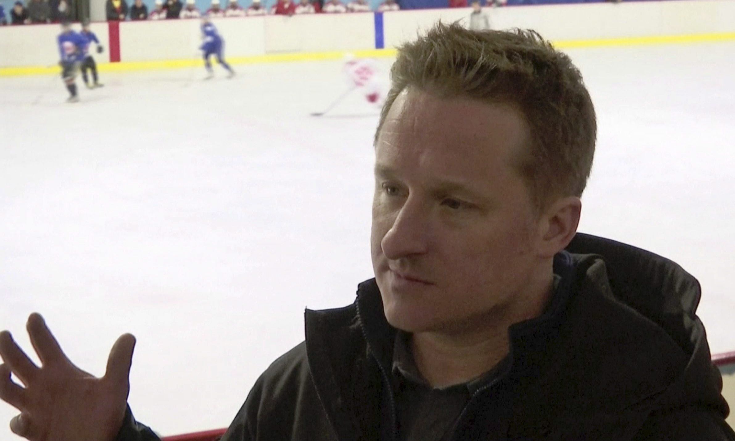 In this image made from video taken on March 11, 2016, entrepreneur Michael Spavor speaks during a friendly ice hockey match between visiting foreigners and North Korean players in Pyongyang, North Korea.  (AP Photo)