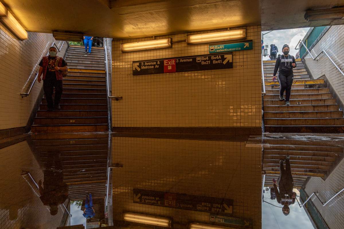 NEW YORK, NY – SEPTEMBER 02: Commuters walk into a flooded 3rd Avenue / 149th st subway station and disrupted service due to extremely heavy rainfall from the remnants of Hurricane Ida on September 2, 2021, in New York City. Multiple fatalities have been reported in the region as the storm passed through New York City, dumping 3.15 inches of rain in the span of an hour in Central Park and causing massive flooding in Brooklyn. (Photo by David Dee Delgado/Getty Images)