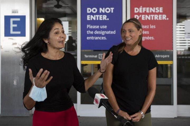 Wife of Michael Kovrig, Vina Nadjibulla (L) and his sister Ariana Botha speak to the media outside Toronto airport before seeing Michael in Toronto, Ontario, on September 25, 2021