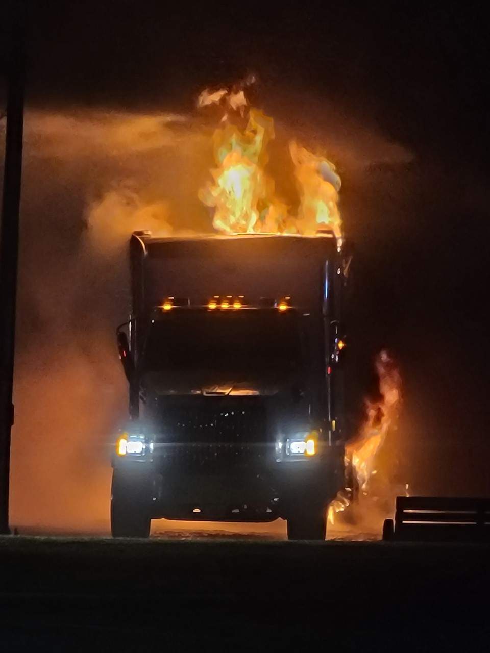 One of the two transport trucks on fire.