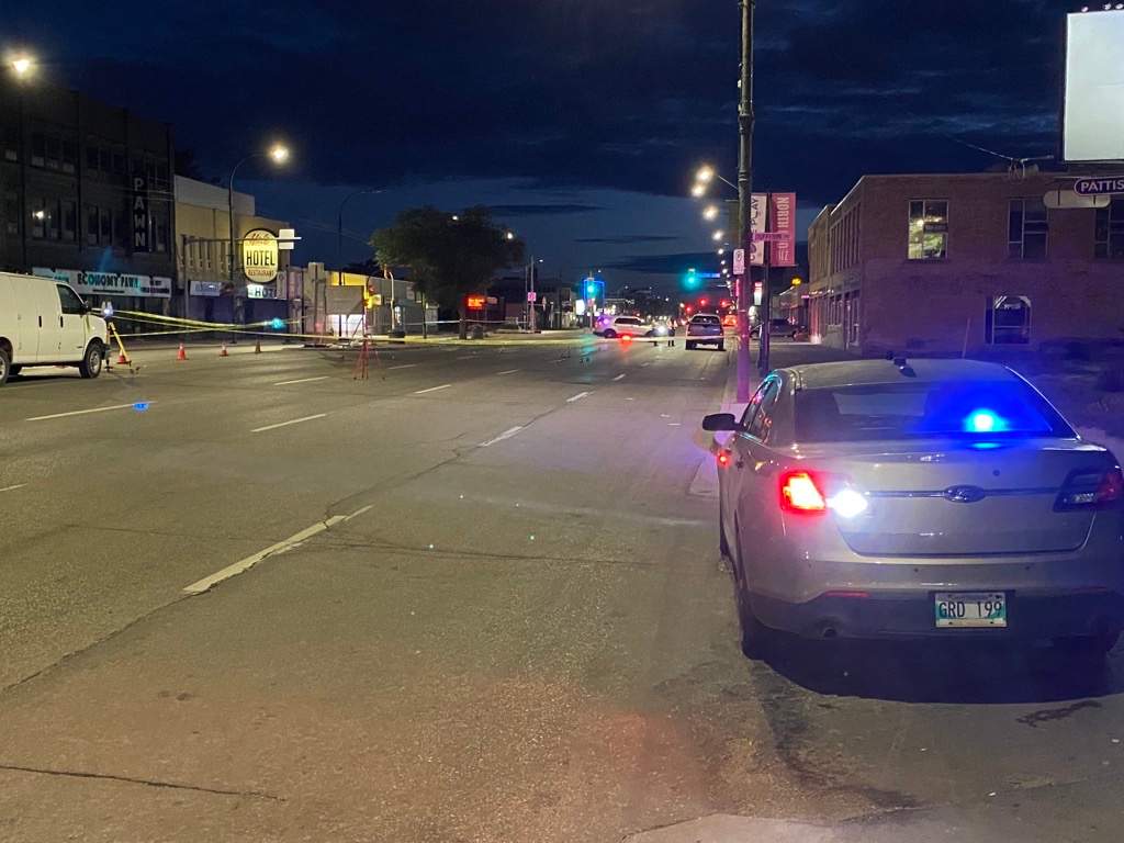 Police at the scene of a crash on Main Street and Dufferin Avenue on Wednesday, Sept. 8, 2021.