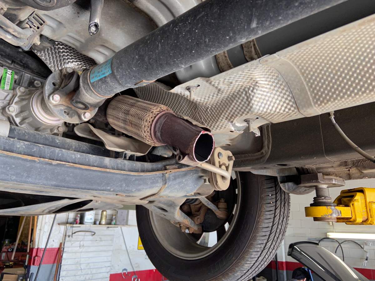 File: What a vehicle looks like when the catalytic converter has been stolen.