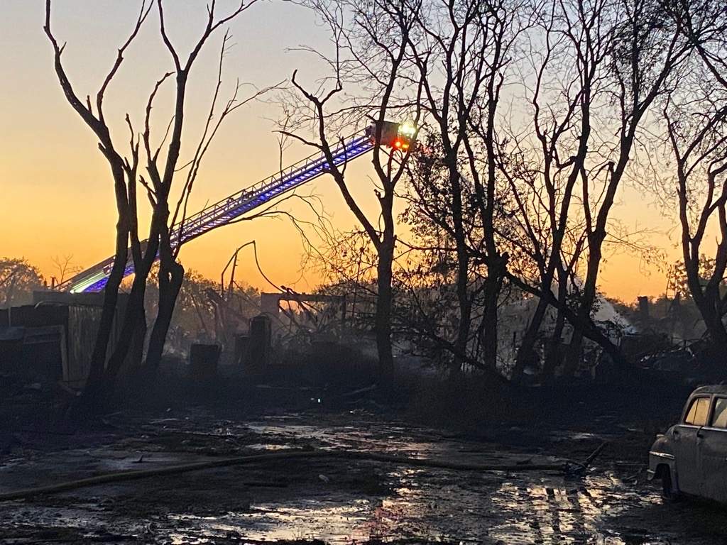 Winnipeg firefighters remain on scene on Higgins Avenue for a warehouse blaze Wednesday, Sept. 29, 2021.