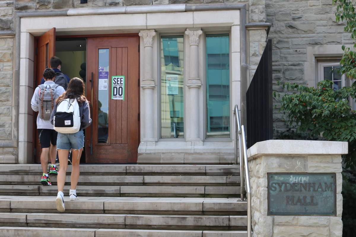 Students walking into Sydenham Hall at Western University on Sept. 13, 2021.