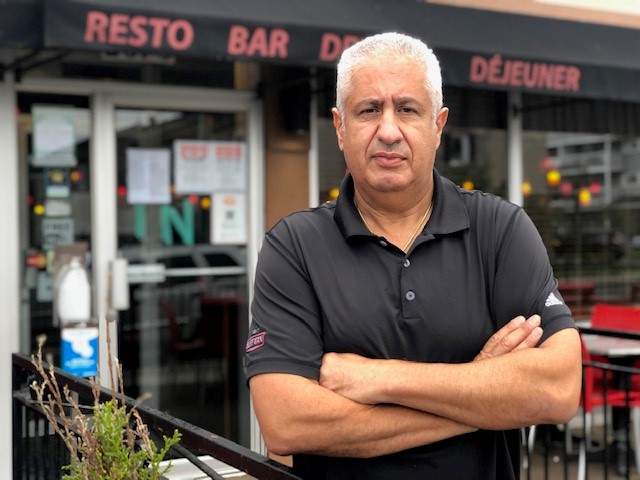 Restaurant owner Bill Mahfouz, pictured outside his restaurant Benny’s All Day in Rockland, Ont., said his staff have faced abuse over Ontario’s proof of vaccination rules.