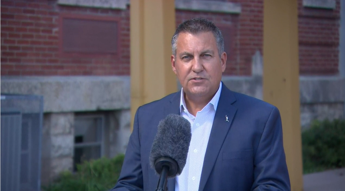 Minister Cliff Cullen speaks to media.