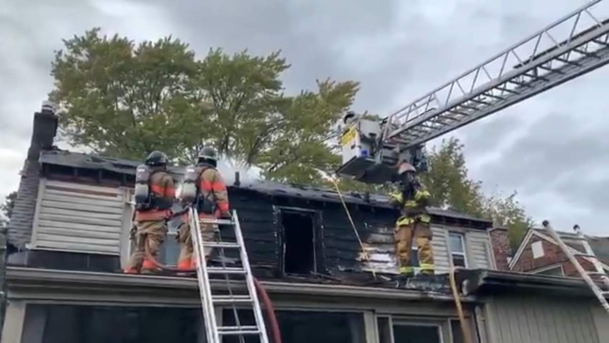 Firefighters dousing hot spots at a home on Regent Street on Sept. 15, 2021.