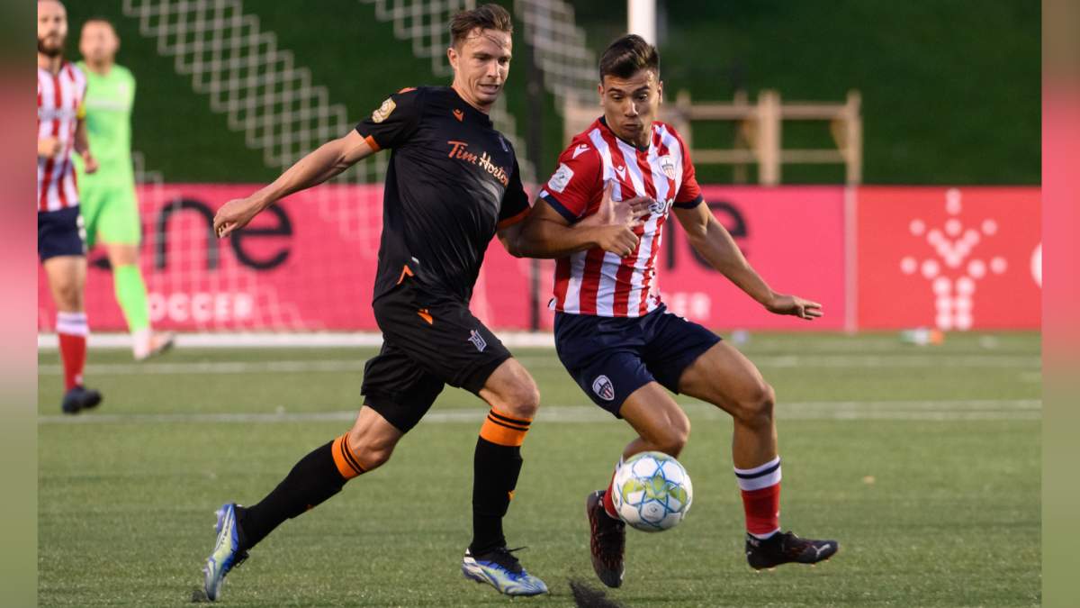 Defender Daniel Krutzen engages forward Raúl Uche Rubio during Forge FCs road game against Atlético Ottawa on Sept. 8, 2021.