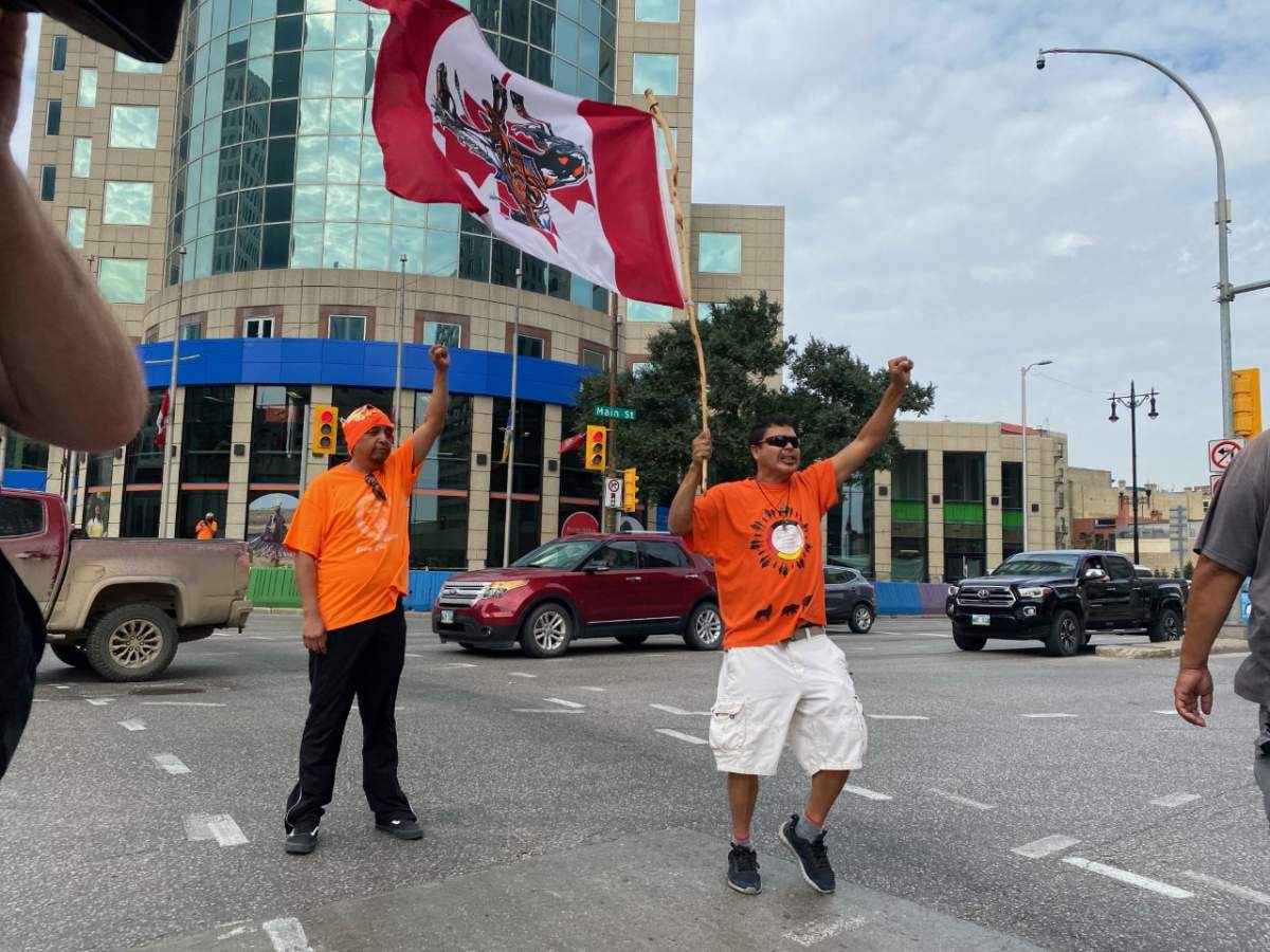 Winnipeg’s Healing Walk made its way through Portage and Main in Winnipeg Thursday afternoon carrying signs, waving flags and dancing.