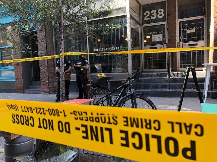 Police at the scene of the stabbing in the area of Sherbourne and King streets on Thursday.
