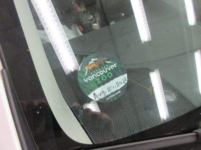 The car has a sticker from the Greater Vancouver Zoo in the windshield.