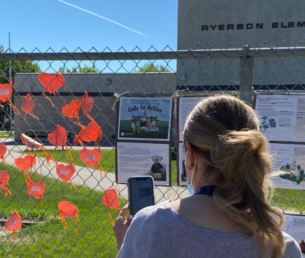 A display in support of residential school survivors outside Winnipeg's Ryerson School this summer.