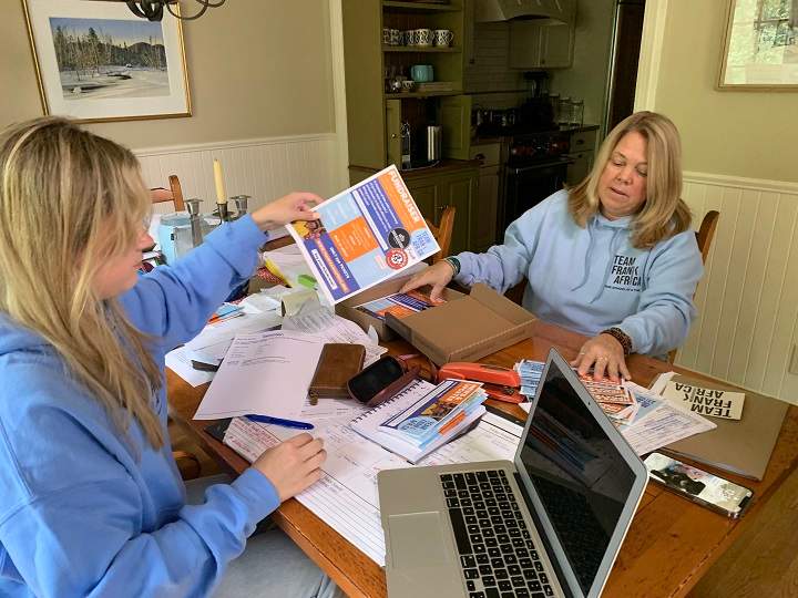Zoe Doyle and mother Kimmy Chedel sorting through Team Frank Africa papers.  Tim Sargeant/Global News