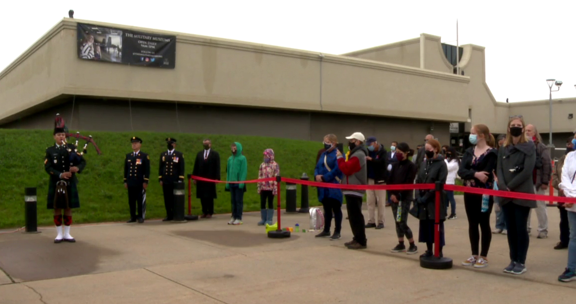 People commemorate the 20th anniversary of 9/11 at the Military Museums in Calgary on Saturday, Sept. 11, 2021.