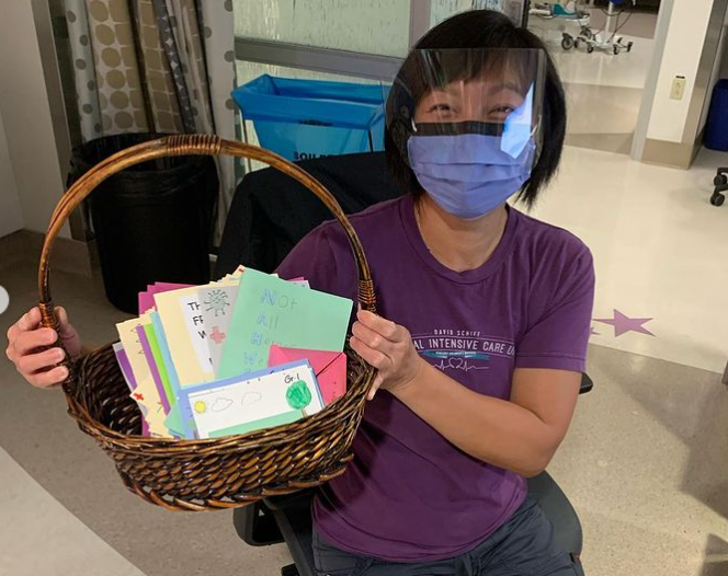 Students at St. Teresa Catholic School in Edmonton write cards for health-care workers at Grey Nuns and University hospitals.