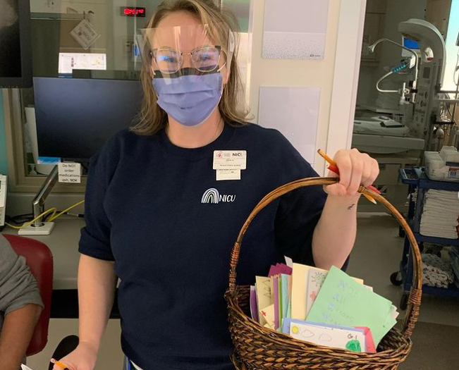 Students at St. Teresa Catholic School in Edmonton write cards for health-care workers at Grey Nuns and University hospitals.