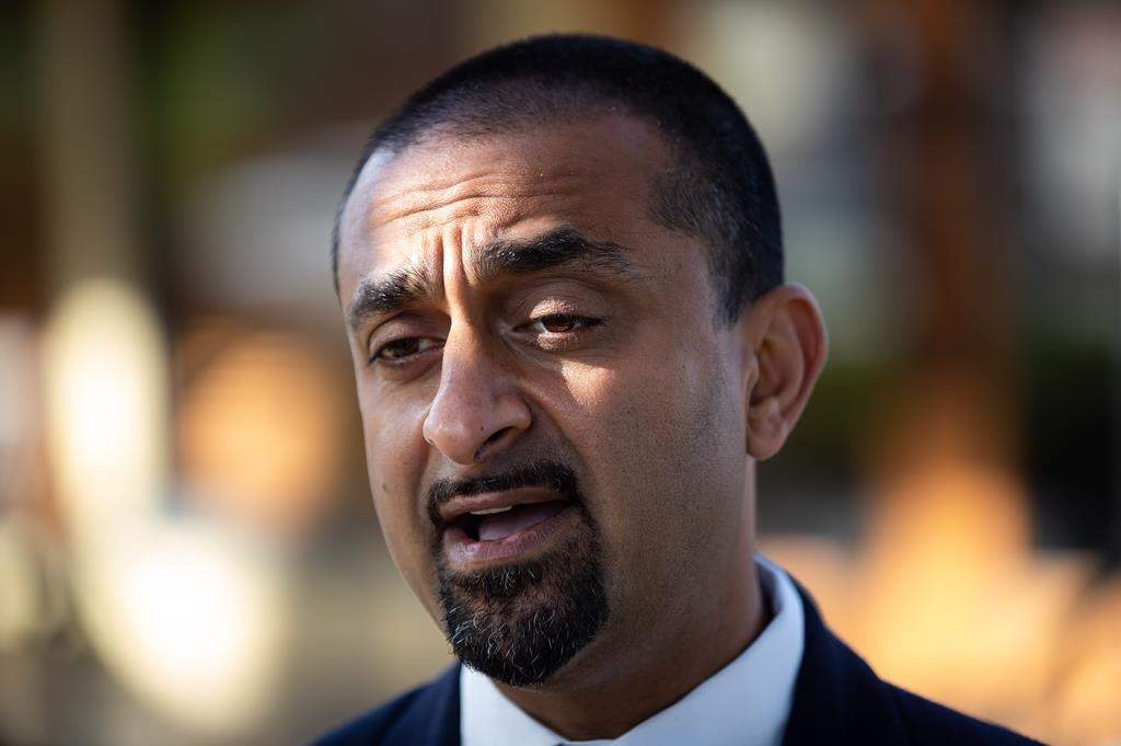 Ravi Kahlon, B.C.'s minister of jobs, economic recovery and innovation, speaks at a restaurant in Delta, B.C., on Wed. Sept. 15, 2021.