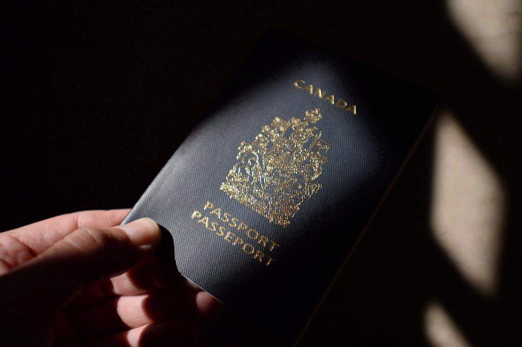 A Canadian passport, July 23, 2015. THE CANADIAN PRESS/Sean Kilpatrick