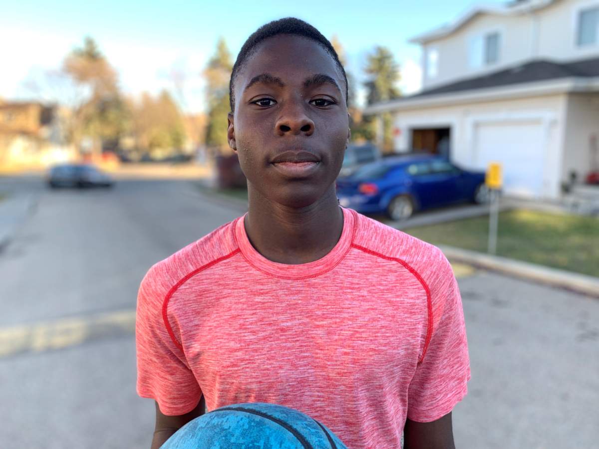 Edmonton teen Anthony Muobike outside his home on Wednesday, Oct. 287, 2021.