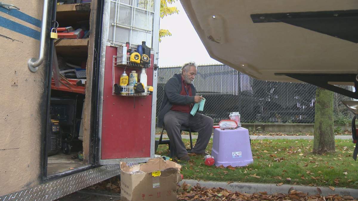 Bill sits outside his RV on 25 Avenue in Vernon.